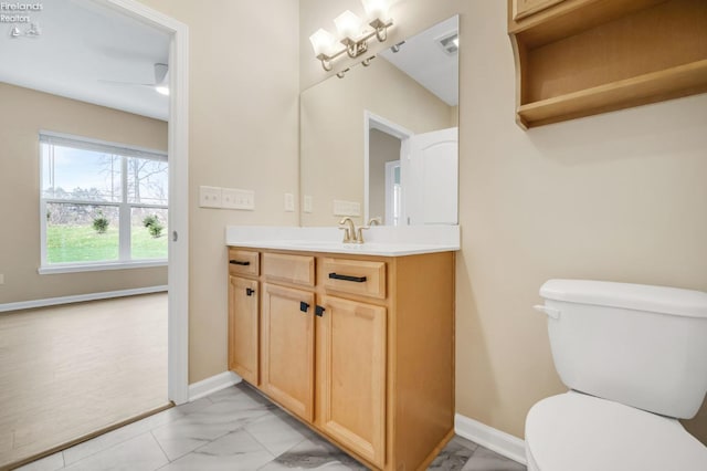 bathroom featuring vanity, marble finish floor, baseboards, toilet, and visible vents