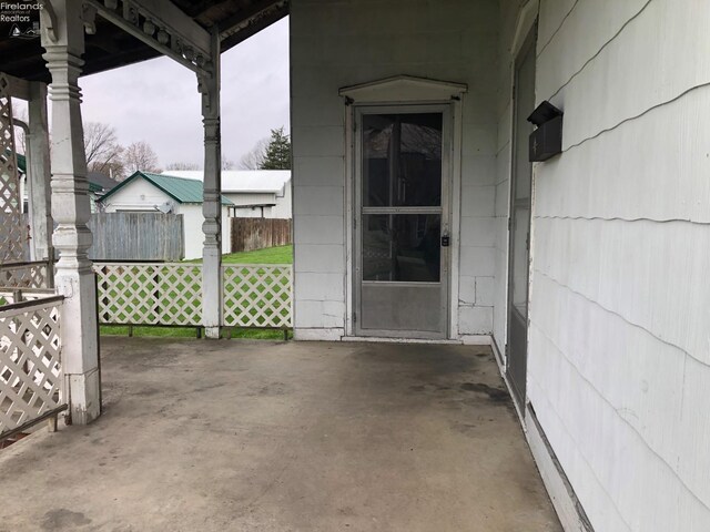 view of patio / terrace featuring fence