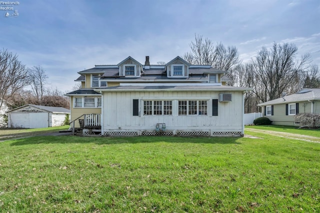 view of front of house with a front lawn, a shingled roof, and a wall unit AC
