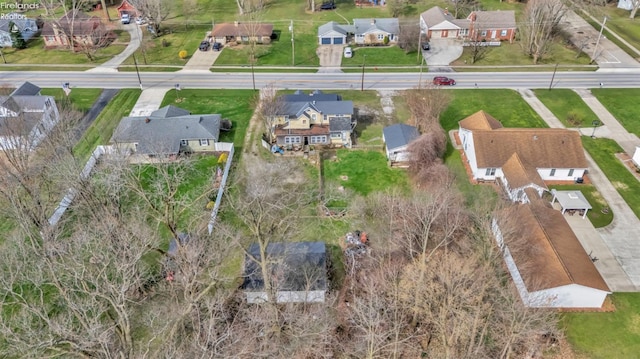 birds eye view of property with a residential view