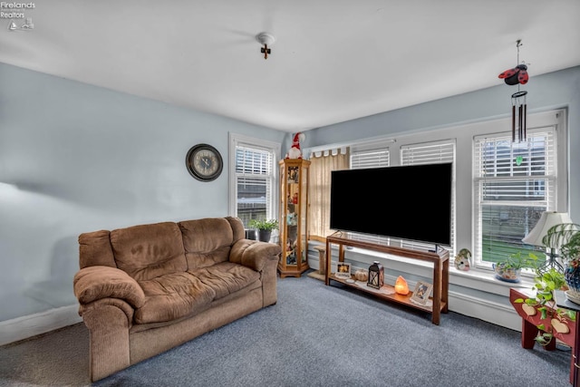 carpeted living area with plenty of natural light