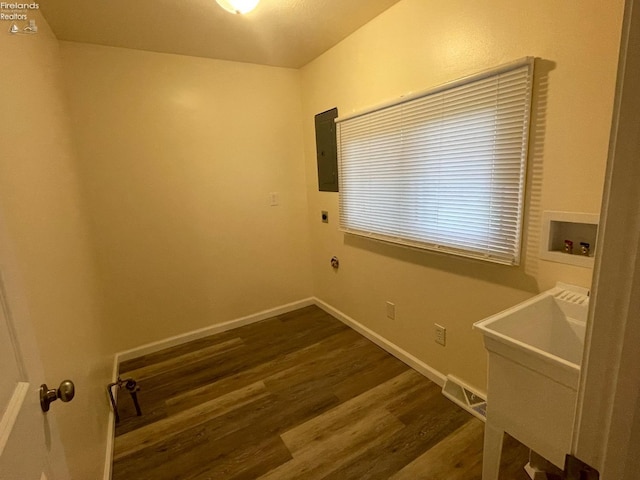 washroom with dark wood-style flooring, electric dryer hookup, baseboards, laundry area, and hookup for a washing machine
