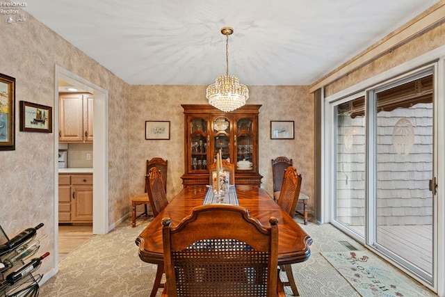 526 Mariner Vlg, Huron, OH 44839 - dining space featuring visible vents, light wood-type flooring, and a chandelier