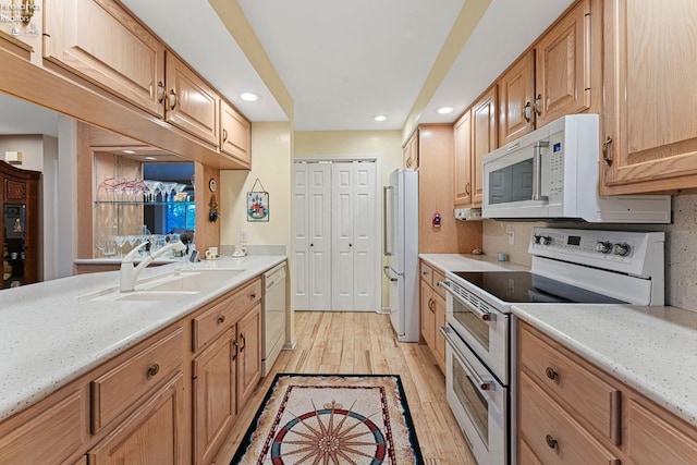 526 Mariner Vlg, Huron, OH 44839 - kitchen with light wood finished floors, a sink, white appliances, and recessed lighting
