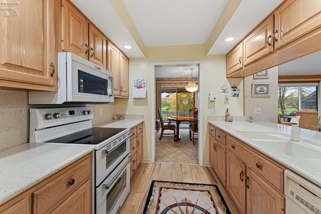 526 Mariner Vlg, Huron, OH 44839 - kitchen with a sink, light wood finished floors, white appliances, and plenty of natural light