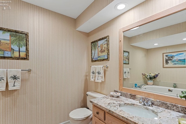 526 Mariner Vlg, Huron, OH 44839 - bathroom with toilet, wallpapered walls, and vanity
