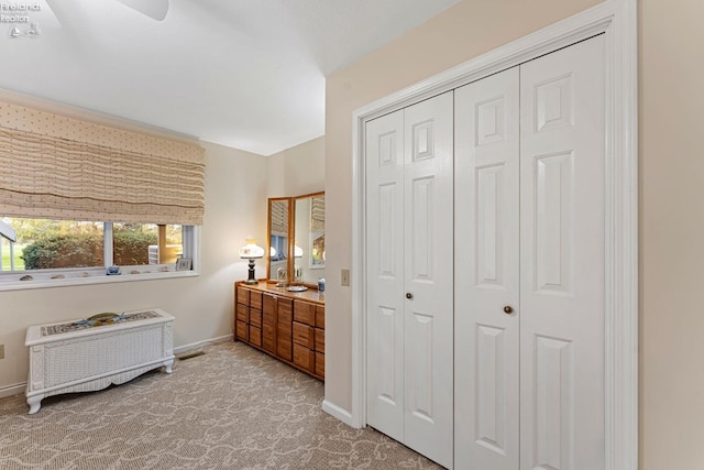 526 Mariner Vlg, Huron, OH 44839 - carpeted bedroom with a closet, baseboards, ceiling fan, and visible vents