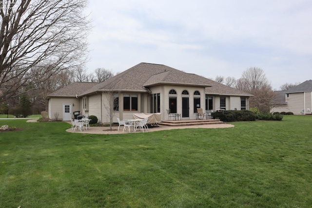 79 Ridgeview Cir, Milan, OH 44846 - rear view of property featuring a patio, a yard, and roof with shingles