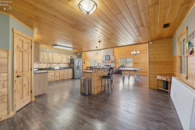 3769 Prospect Rd, New London, OH 44851 - kitchen with a kitchen breakfast bar, light brown cabinets, stainless steel fridge, dark countertops, and wooden ceiling