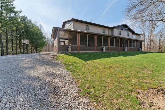 3769 Prospect Rd, New London, OH 44851 - rear view of property featuring a yard, a sunroom, and driveway