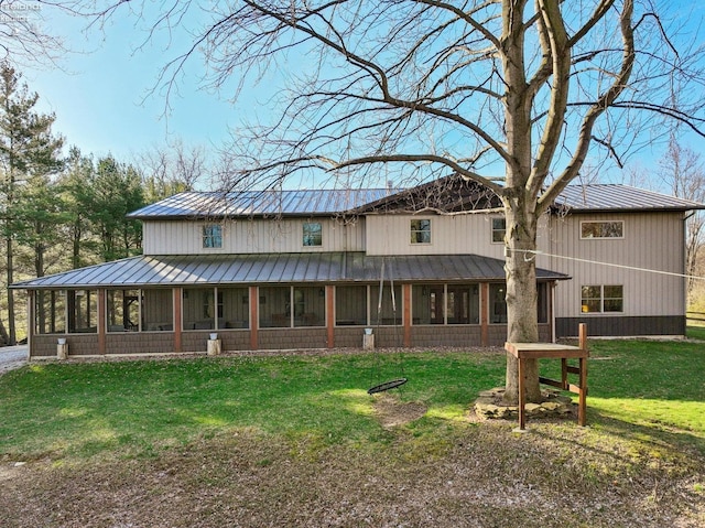 3769 Prospect Rd, New London, OH 44851 - back of house with a yard, metal roof, and a sunroom