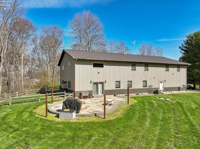 3769 Prospect Rd, New London, OH 44851 - back of house featuring a patio area, metal roof, fence, and a lawn