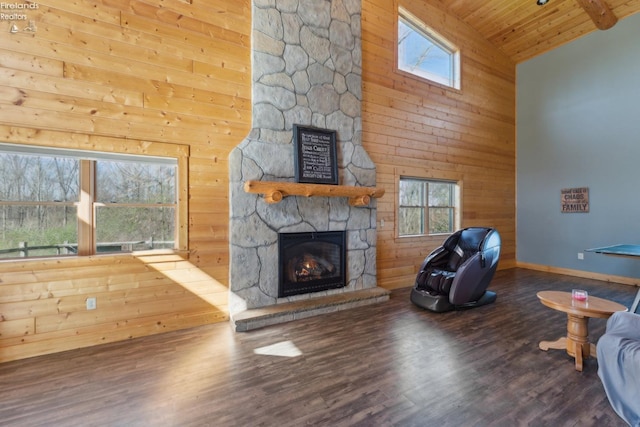 3769 Prospect Rd, New London, OH 44851 - unfurnished living room featuring wooden ceiling, a stone fireplace, wooden walls, wood finished floors, and high vaulted ceiling