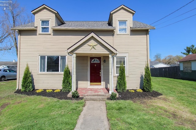 3510 Ohio St, Sandusky, OH 44870 - view of front facade with a shingled roof, a front yard, and fence