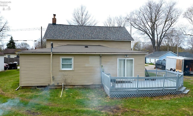 3510 Ohio St, Sandusky, OH 44870 - back of property with roof with shingles, a wooden deck, a chimney, and a lawn
