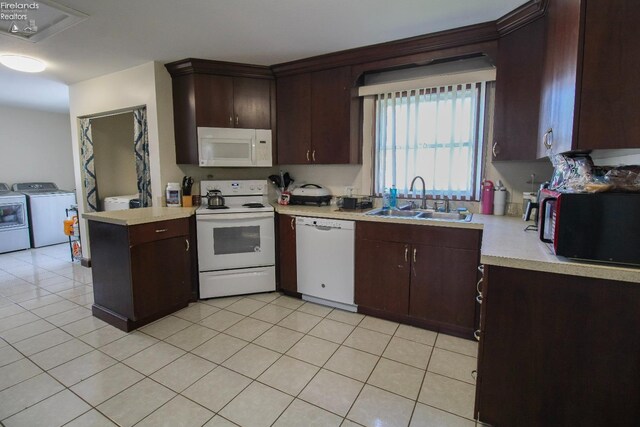 3510 Ohio St, Sandusky, OH 44870 - kitchen featuring white appliances, dark brown cabinets, light countertops, a sink, and washer and clothes dryer