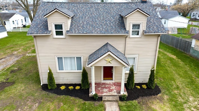 3510 Ohio St, Sandusky, OH 44870 - view of front of house featuring roof with shingles, a front yard, and fence