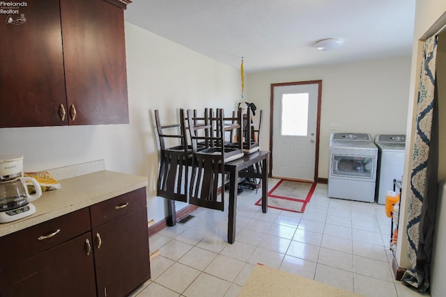 3510 Ohio St, Sandusky, OH 44870 - dining space featuring separate washer and dryer, baseboards, and light tile patterned flooring
