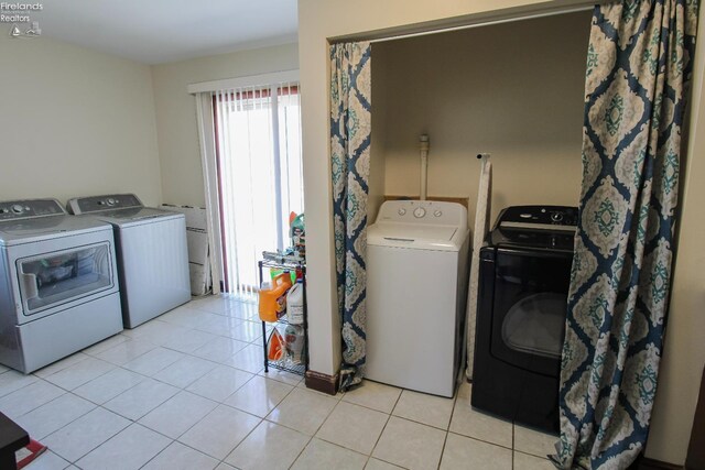 3510 Ohio St, Sandusky, OH 44870 - laundry area featuring independent washer and dryer and light tile patterned floors