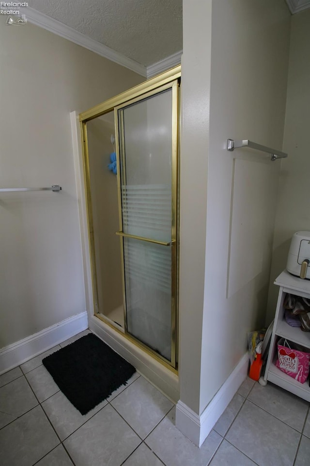 3510 Ohio St, Sandusky, OH 44870 - bathroom featuring crown molding, tile patterned flooring, baseboards, and a stall shower