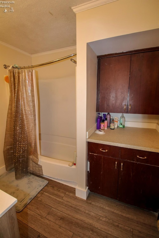 3510 Ohio St, Sandusky, OH 44870 - bathroom with shower / bath combination with curtain, a textured ceiling, ornamental molding, and wood finished floors