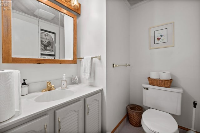bathroom featuring toilet and vanity