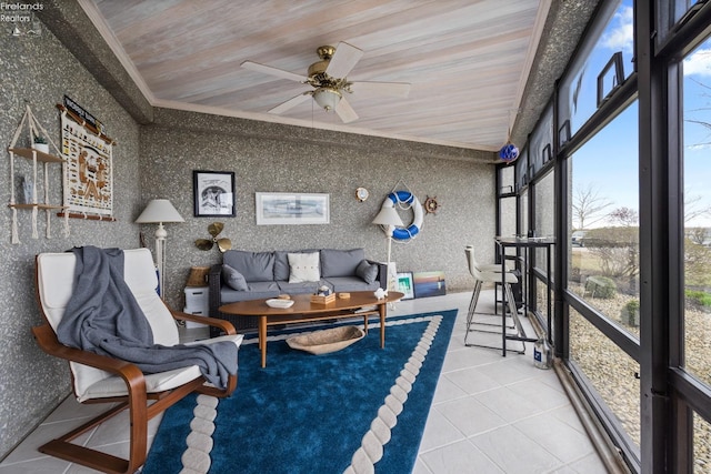 sunroom featuring an outdoor living space and ceiling fan