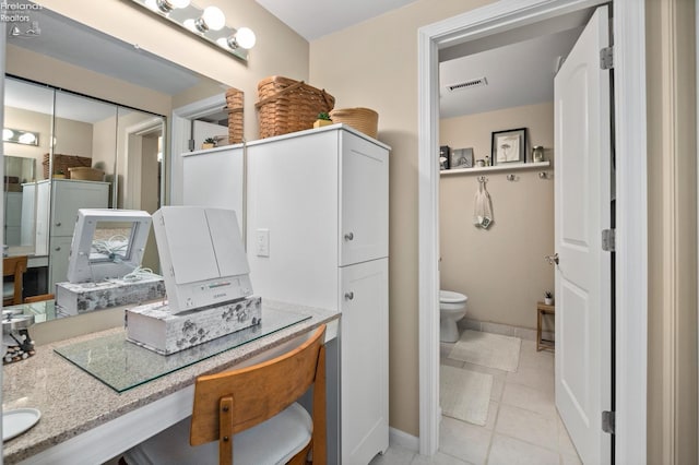 bathroom with visible vents, toilet, baseboards, and tile patterned floors