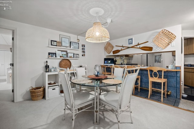 view of carpeted dining space