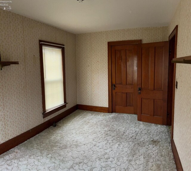 unfurnished bedroom featuring carpet floors