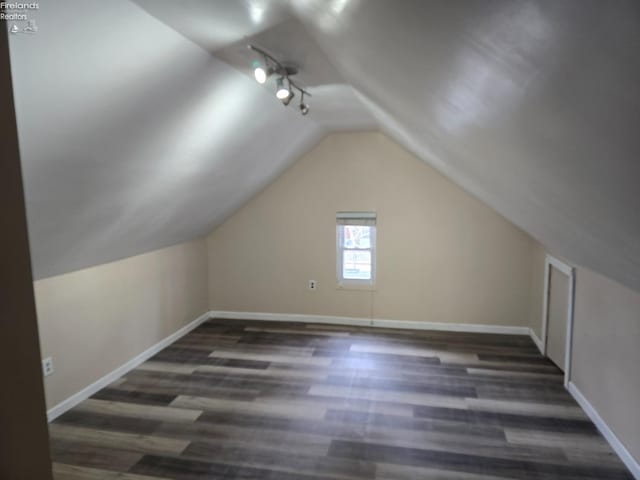 430 Perry St, Sandusky, OH 44870 - additional living space featuring baseboards, wood finished floors, and vaulted ceiling