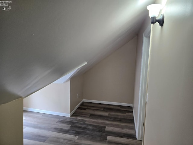 430 Perry St, Sandusky, OH 44870 - bonus room with wood finished floors, baseboards, and lofted ceiling
