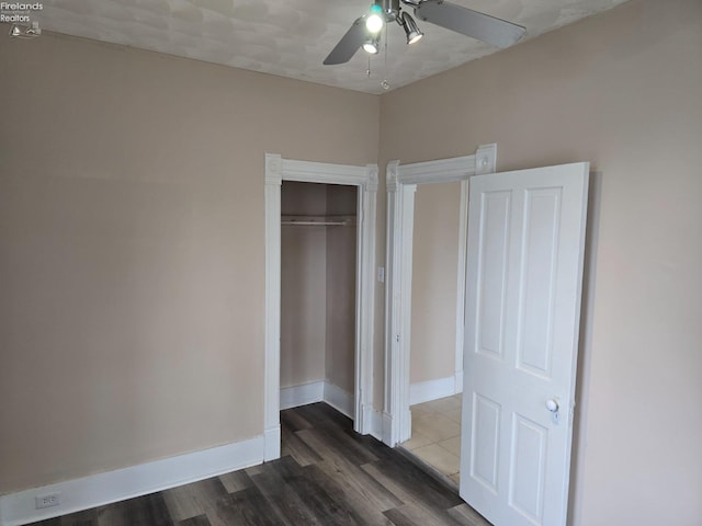 430 Perry St, Sandusky, OH 44870 - unfurnished bedroom with a closet, baseboards, a ceiling fan, and wood finished floors