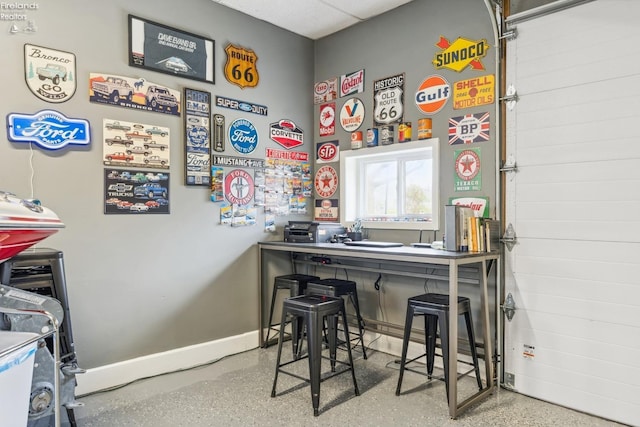 interior space featuring baseboards