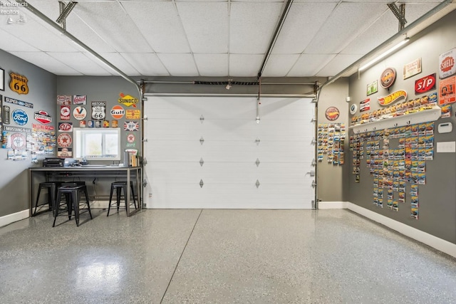 garage featuring baseboards