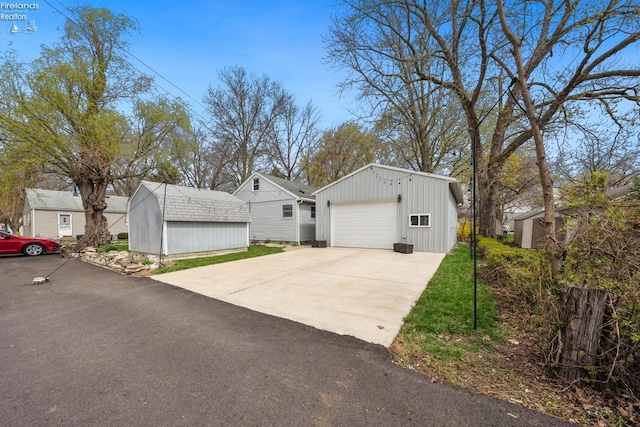 exterior space featuring an outbuilding and a detached garage
