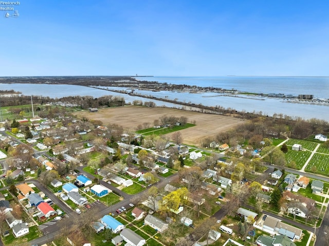 aerial view featuring a residential view and a water view
