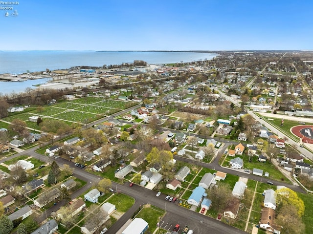 bird's eye view with a residential view and a water view