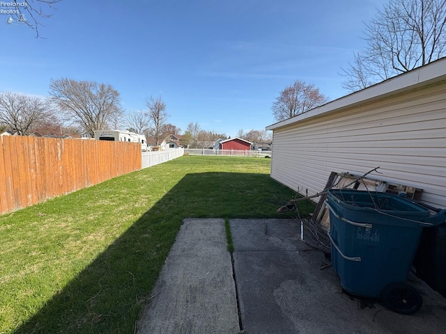 view of yard featuring fence and a patio area
