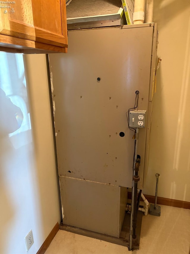 room details featuring heating unit and baseboards