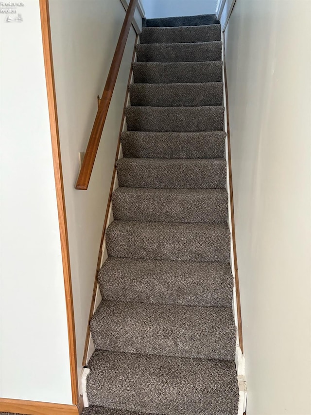 stairway with baseboards