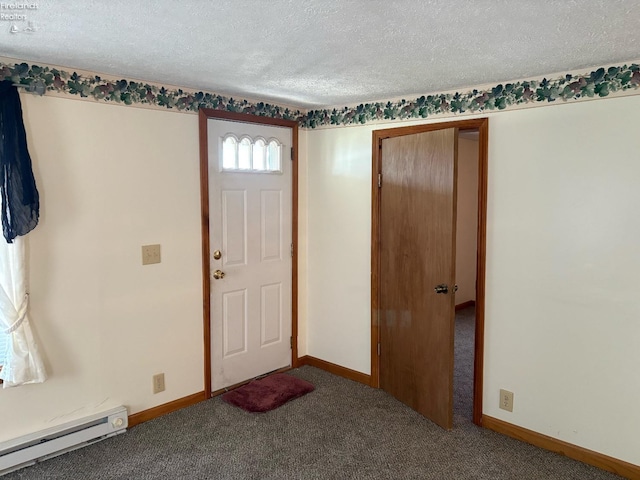 entrance foyer with a baseboard heating unit, carpet floors, a textured ceiling, and baseboards