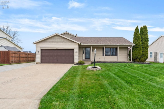 1001 Birchwood Dr, Sandusky, OH 44870 - single story home with fence, a shingled roof, a front lawn, concrete driveway, and a garage