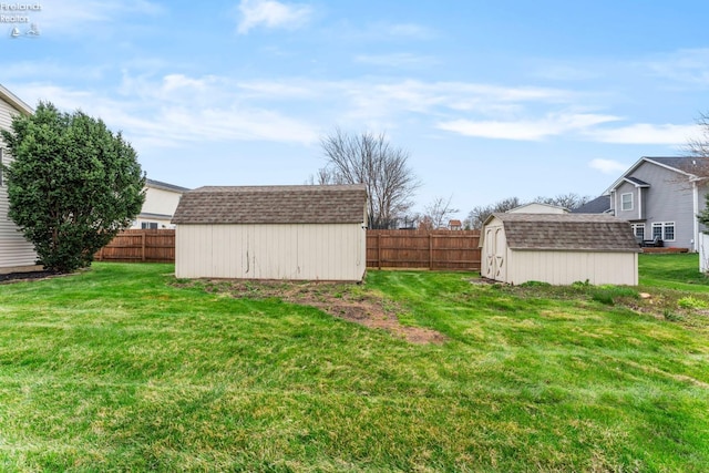 1001 Birchwood Dr, Sandusky, OH 44870 - view of yard featuring a storage shed, fence, and an outdoor structure