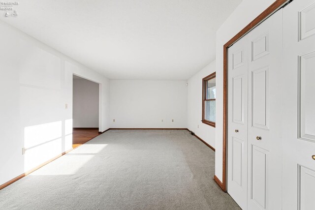 1001 Birchwood Dr, Sandusky, OH 44870 - unfurnished bedroom featuring carpet floors and baseboards
