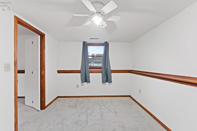 1001 Birchwood Dr, Sandusky, OH 44870 - carpeted empty room with ceiling fan, baseboards, and visible vents