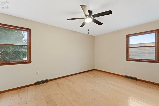 1001 Birchwood Dr, Sandusky, OH 44870 - unfurnished room featuring visible vents, ceiling fan, and a healthy amount of sunlight