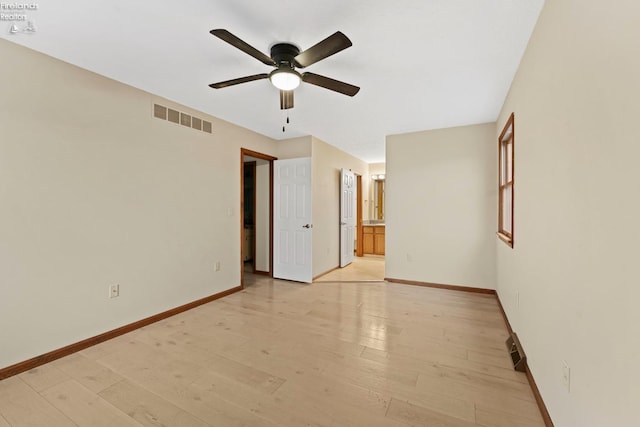 1001 Birchwood Dr, Sandusky, OH 44870 - empty room with baseboards, light wood-style flooring, visible vents, and ceiling fan