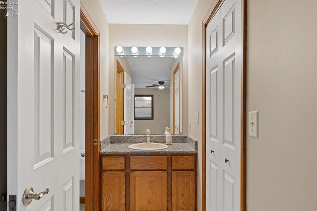 1001 Birchwood Dr, Sandusky, OH 44870 - bathroom featuring a ceiling fan and vanity