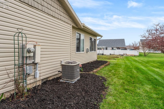 1001 Birchwood Dr, Sandusky, OH 44870 - view of side of property featuring central AC and a yard